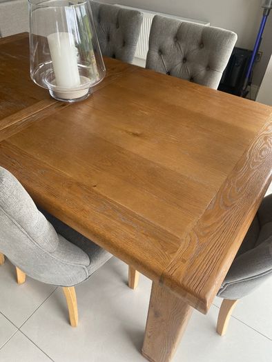 Solid oak dining table and chairs