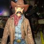 Large Vintage Ceramic Cowboy Figurine Hand Painted brown jacket and a detailed saddle resting at his feet Postage Available or Collection Image 4