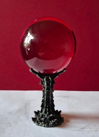 Red crystal/glass ball and metal dragon stand.