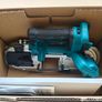 Makita bandsaws and charger Image 2