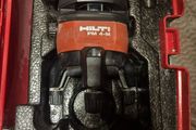 Hilti PM 4M Multi-Line Laser  Hilti PM 4M cordless multi-line laser with 360-degree rotation base, including the original red hardshell carry case.