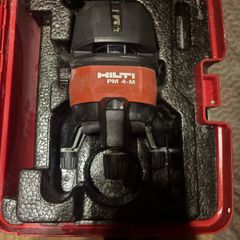 Hilti PM 4M Multi-Line Laser  Hilti PM 4M cordless multi-line laser with 360-degree rotation base, including the original red hardshell carry case.