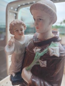 Antique Bisque Porcelain Statue of Saint Anthony holding Child Jesus.