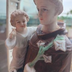 Antique Bisque Porcelain Statue of Saint Anthony holding Child Jesus.