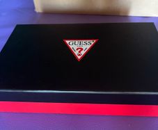 Guess purse brand new with wrist handle and in a box