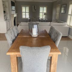 Solid oak dining table and chairs