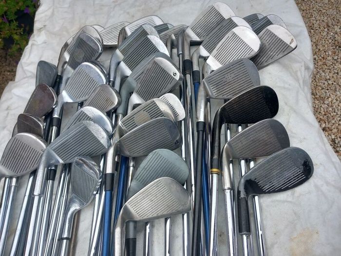 A selection of golf clubs and bags. NOT SELLING SEPARATE