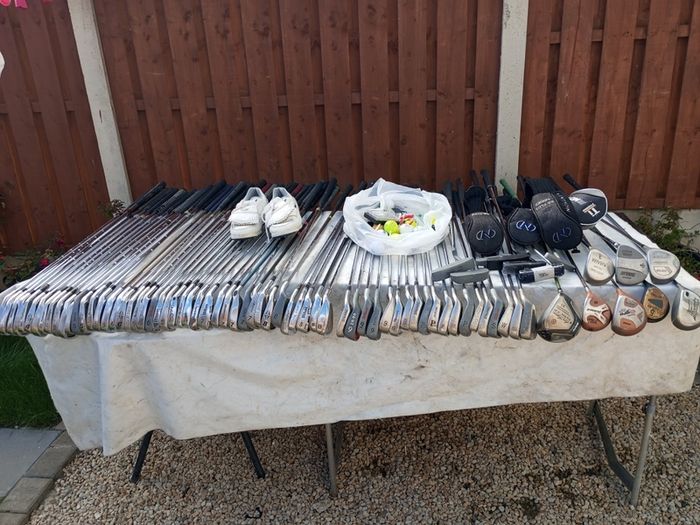 A selection of golf clubs and bags. All right handed clubs.