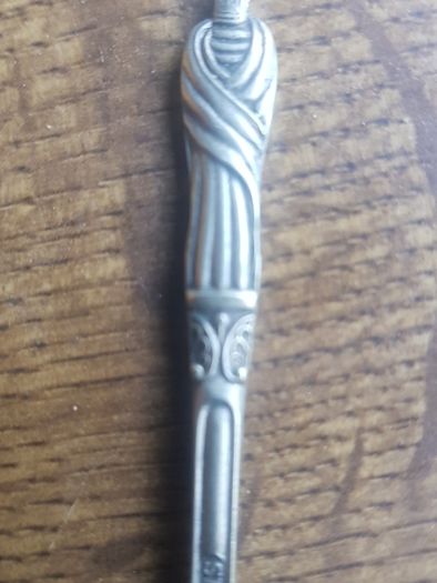 Vintage teaspoon with a saint on the handle