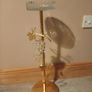 gold-finished, freestanding decorative stand features a clear glass top tray Image 2