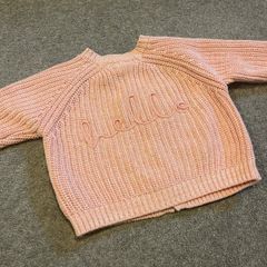 Tags on: Boutique branded pink baby cardigan with HELLO on back