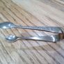 ornate silver sugar tongs Image 2