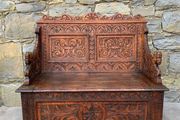 Late Victorian Gothic Revival Carved Oak Hall Settle.