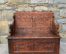 Late Victorian Gothic Revival Carved Oak Hall Settle.