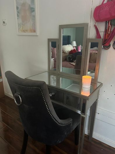 Mirrored vanity table with matching chair
