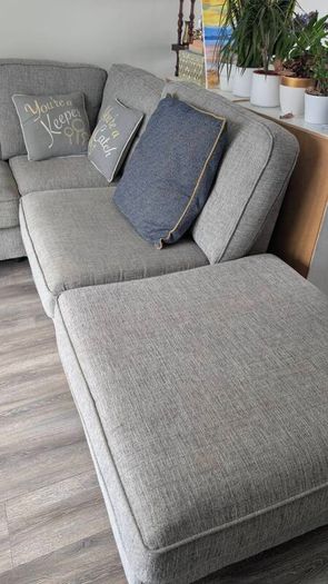 Gray fabric corner chase sofa with footstool