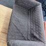 Grey quilted sofa with white metal frame Image 7