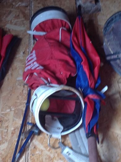 Golf bags and some golf clubs