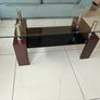 Glass coffee table with dark wood base Image 3