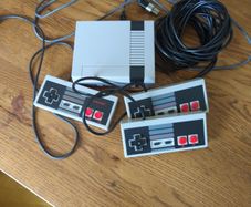 Retro NES loaded with games with 1 original controller and two super long cable controllers