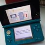 Aqua Blue Nintendo 3DS with games Image 2
