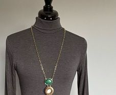 Gold tone necklace with malachite and shell