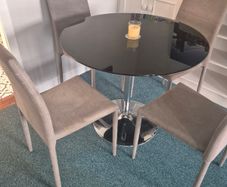 Smoked glass dining table & chairs + coffee table
