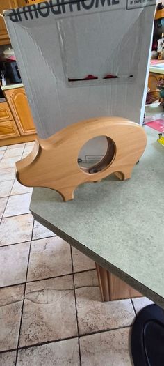 wooden piggy bank featuring a clear viewing window so you can see your savings grow.