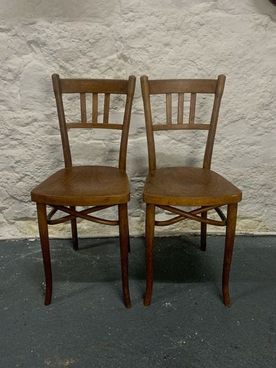 A pair of tall Thonet bentwood chairs.