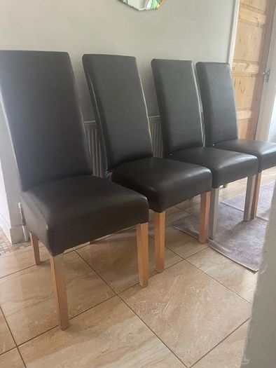 4 dark brown dining room chairs & 4 stretch covers