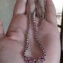 Beautiful necklace in silver tone with pink crystals in the form of flowers. Image 2
