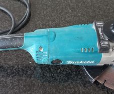 Makita GA9020S  corded angle grinder,  complete with a diamond blade.