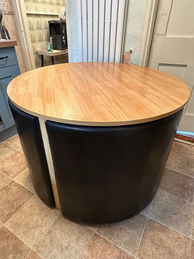 Round nested dining table and 4 chairs.