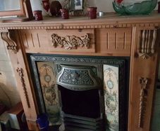 Cast Iron Fireplace with Wooden Surround and Hearth Tiles