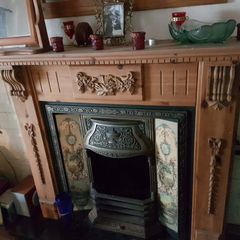 Cast Iron Fireplace with Wooden Surround and Hearth Tiles