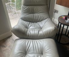 Grey swivel chair and footstool