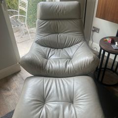 Grey swivel chair and footstool