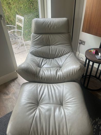 Grey swivel chair and footstool