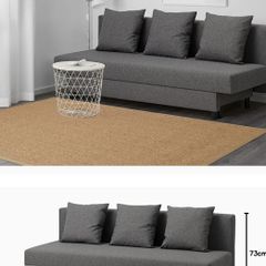 Grey IKEA Asarum sofa bed with 3 cushions