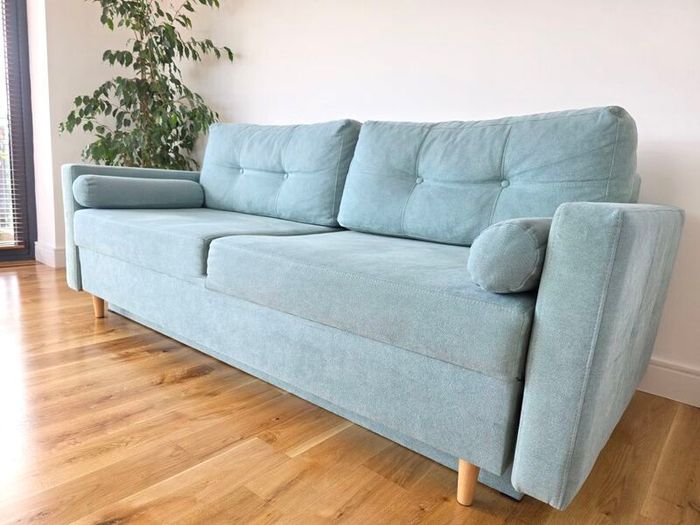 Sofa Bed. Sleeping fuction with Storage container. Comfortable sleep for your guests. High quality materials. Impeccable condition. Decorative pillows included.