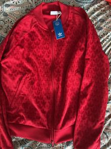 Red adidas top.  Ladies.  New.