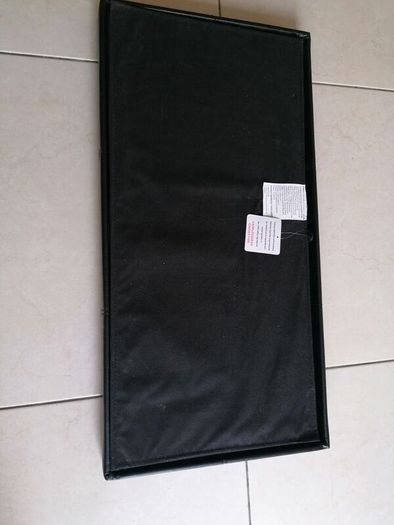 Black faux-leather folding storage ottoman