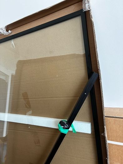 Unused Bath Screen in Packaging. Black frame.