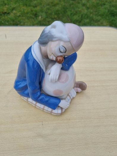 Porcelain sleeping clown with ball