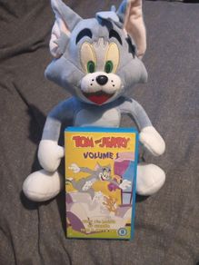 Tom and Jerry vhs tape and plush toy