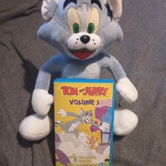 Tom and Jerry vhs tape and plush toy