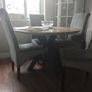 table and four chairs and four cream chair covers Image 3