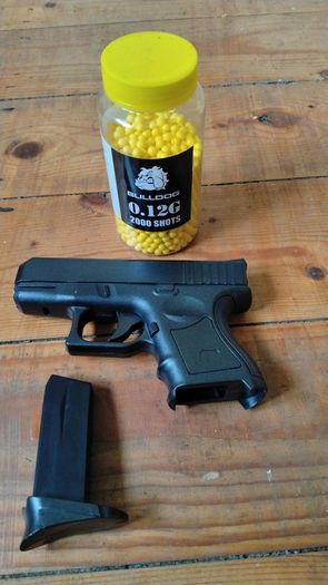 Plastic spring loaded bb gun
