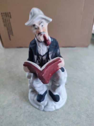 Figurine OF Old Man Sitting On Bench, Smoking His Pipe Reading Book Vintage