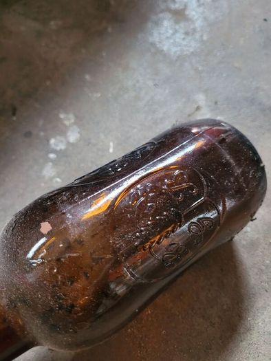 Grolsch beer brown glass bottles with porcelain swing caps.